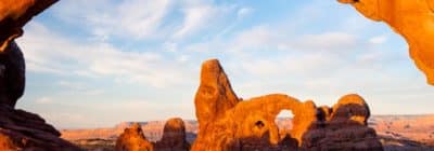 Arches National Park, Utah: Turret Arch through North Window at sunrise.