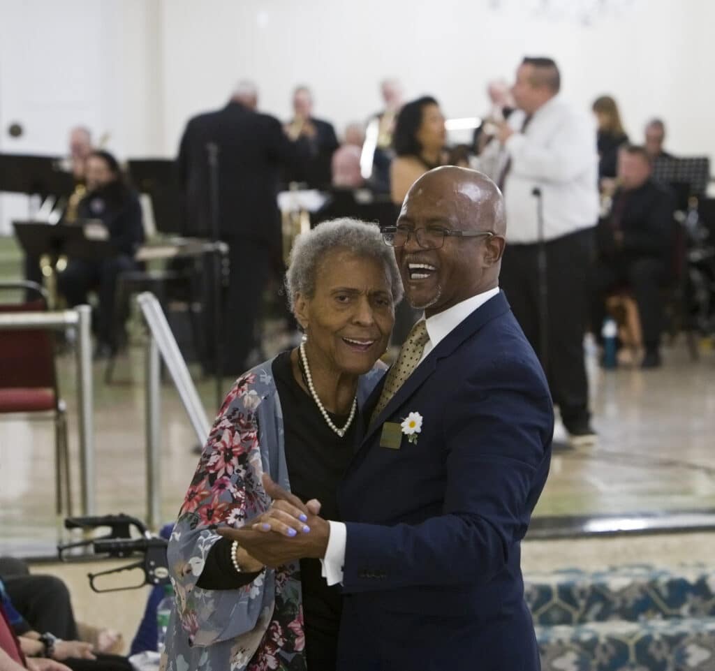 Joan Ezell and Moses Willimas Jr. dance as the Swing Set orchestra performs at Oak Park Arms summer dance.
